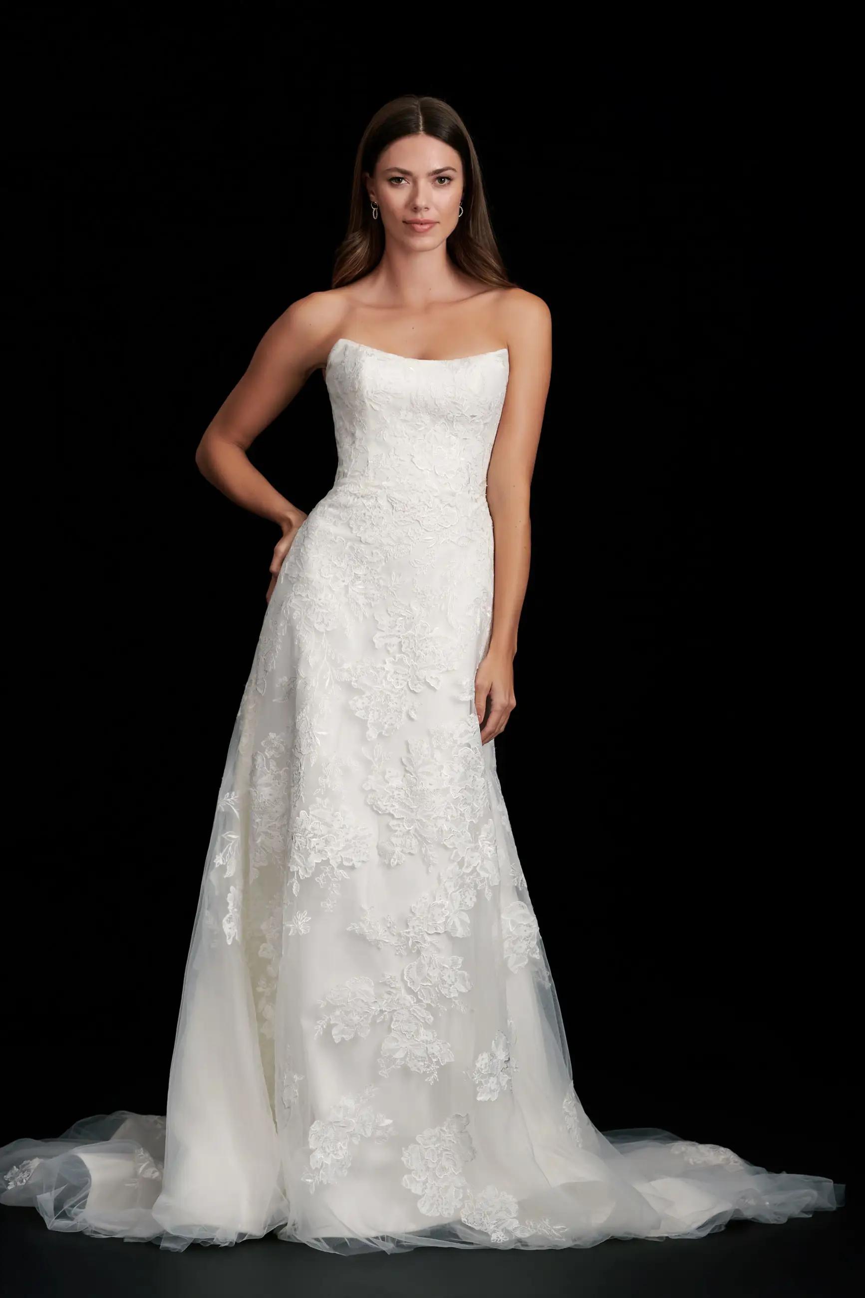 Regina wedding dress in Columbus, Ohio by Kelly Faetanini with slim a line skirt and all over lace, scoop neckline and bow detail