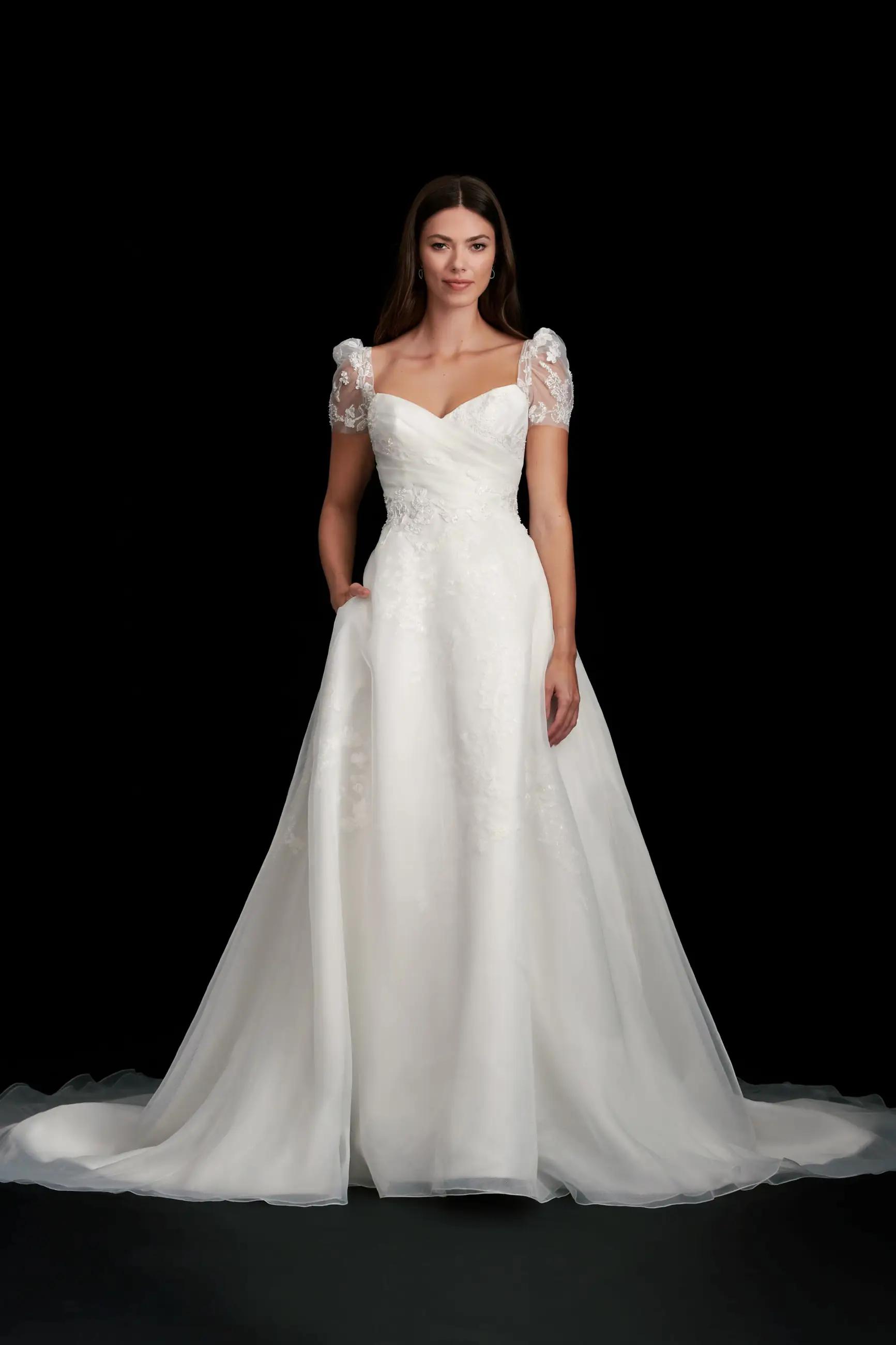 Camilla wedding dress by Kelly Faetanini with cap sleeves, a line skirt and pleated sweetheart bodice