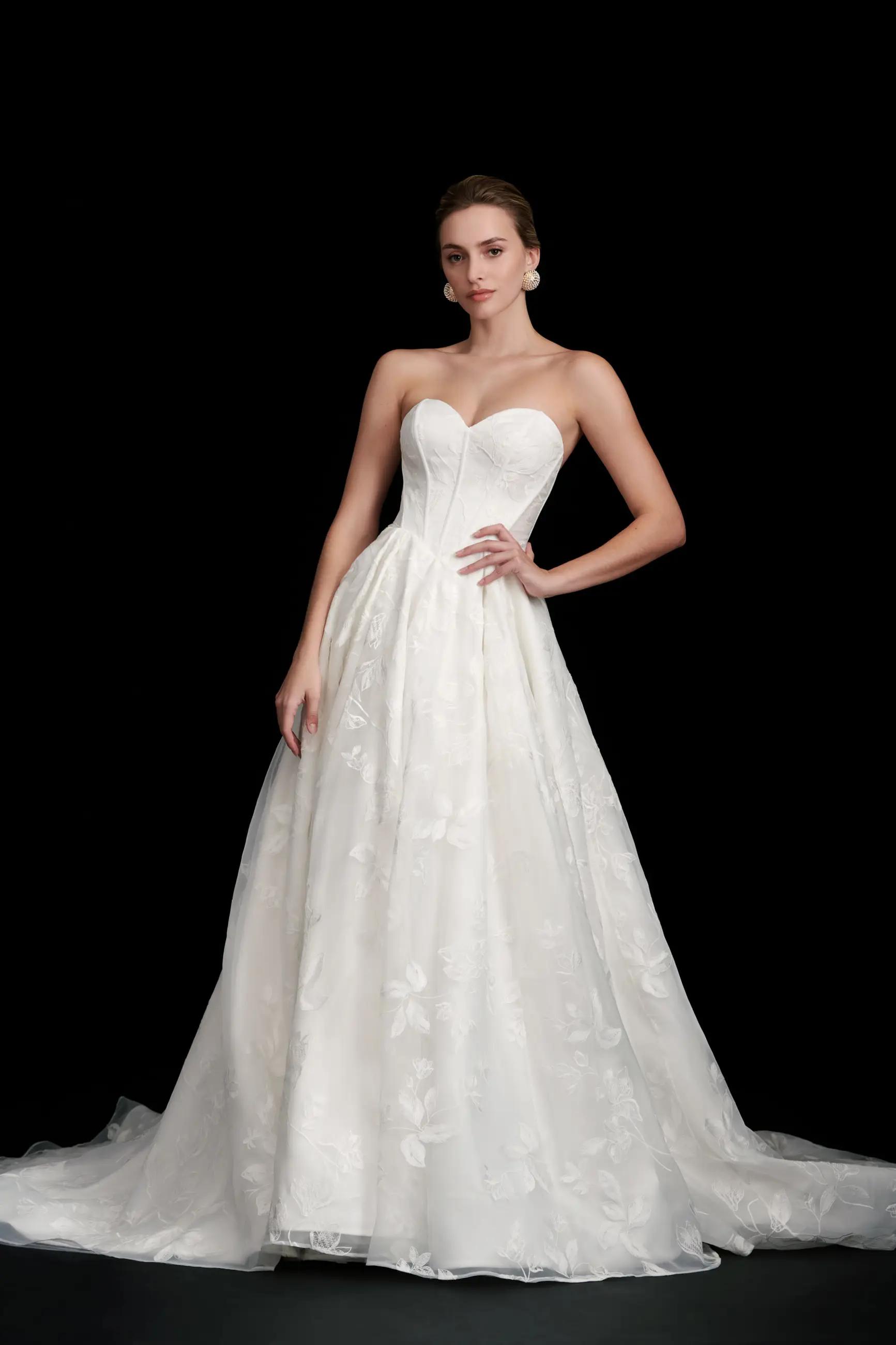Noor wedding dress with floral embroidery and drop modified Basque waistline with sweetheart neckline and corset bodice ballgown skirt