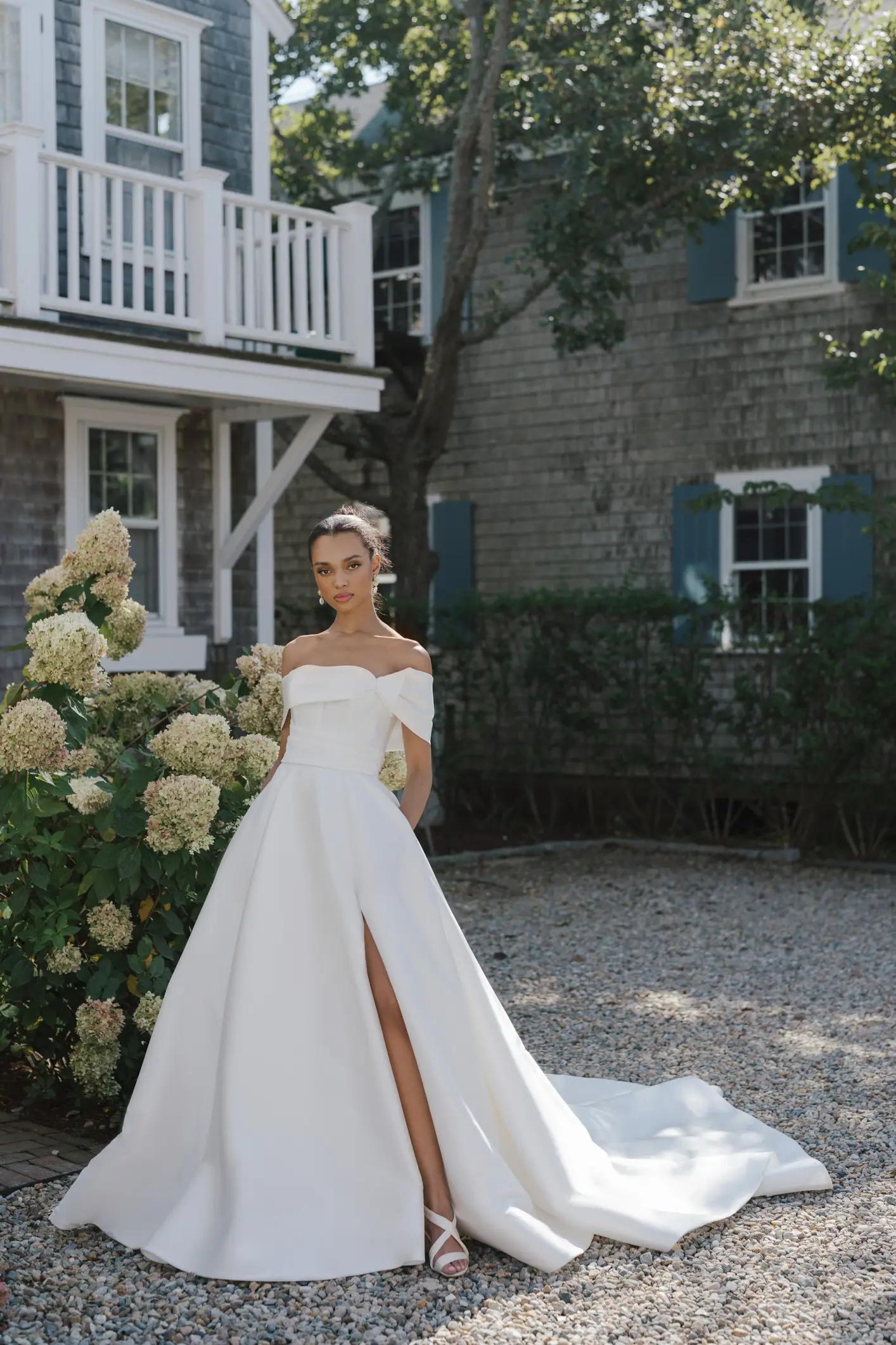 Warren ballgown wedding dress by Anne Barge in Columbus, Ohio with off the shoulder corset bodice and slit