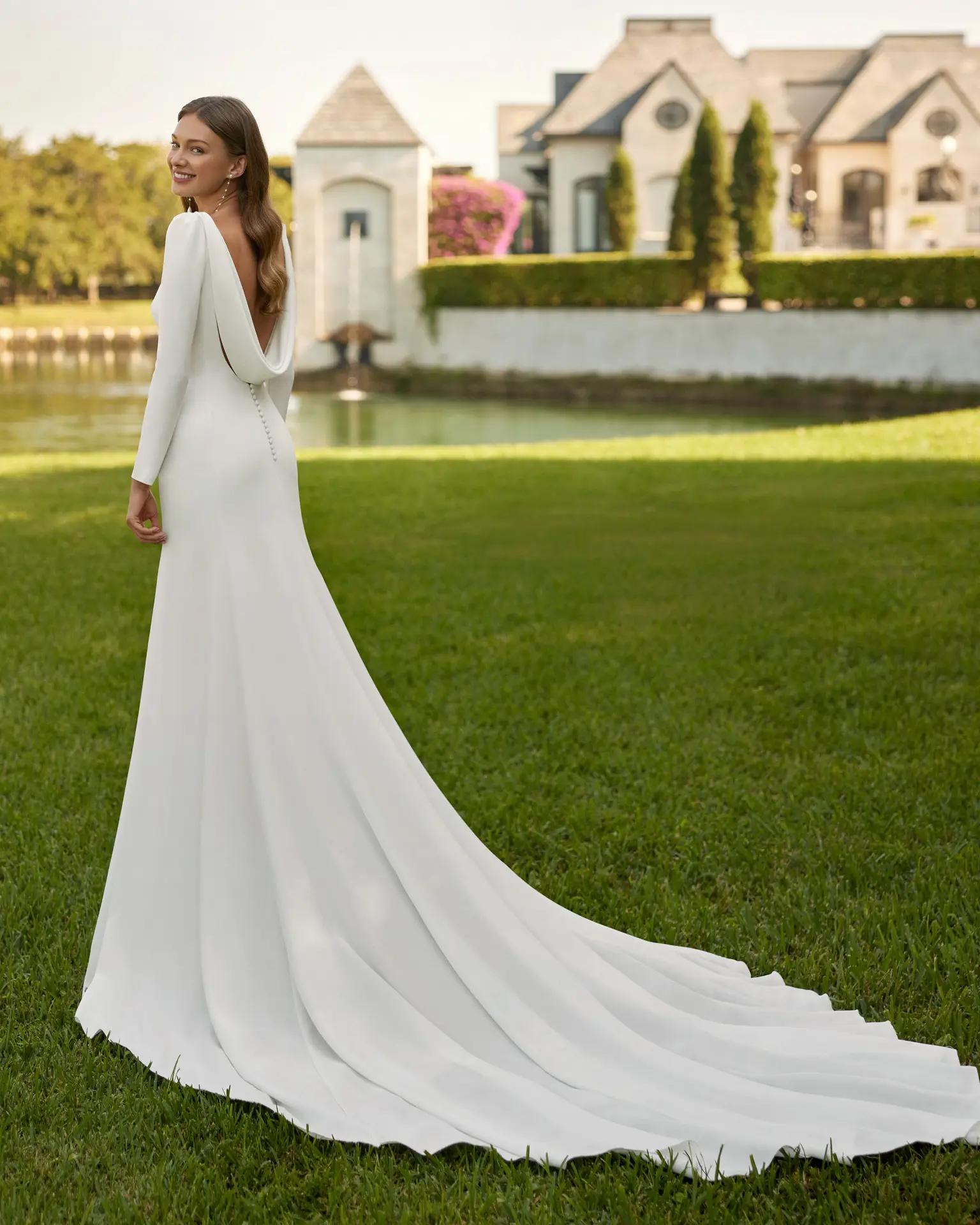 Edana crepe wedding dress by Rosa Clara with long sleeves cathedral train and cowl back boat high neckline