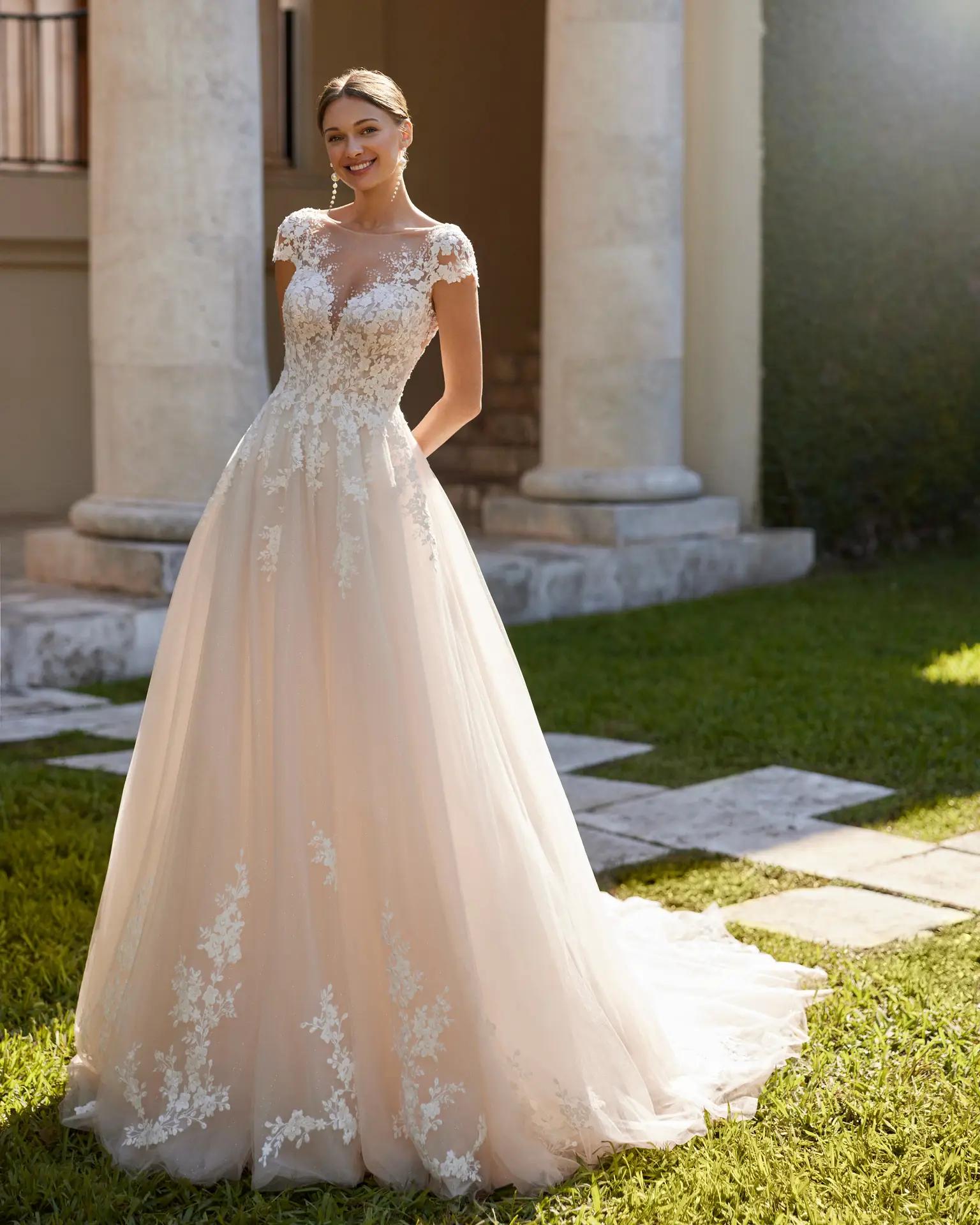Blush wedding dress with cap sleeves and illusion V neckline by Rosa Clara in Columbus, Ohio style Ennis