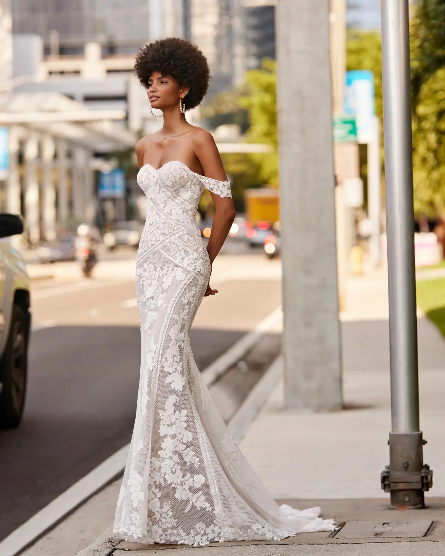 Kya wedding dress by Rosa Clara in Columbus Ohio with sweetheart neckline, detailed lace, and off the shoulder straps on a fitted silhouette