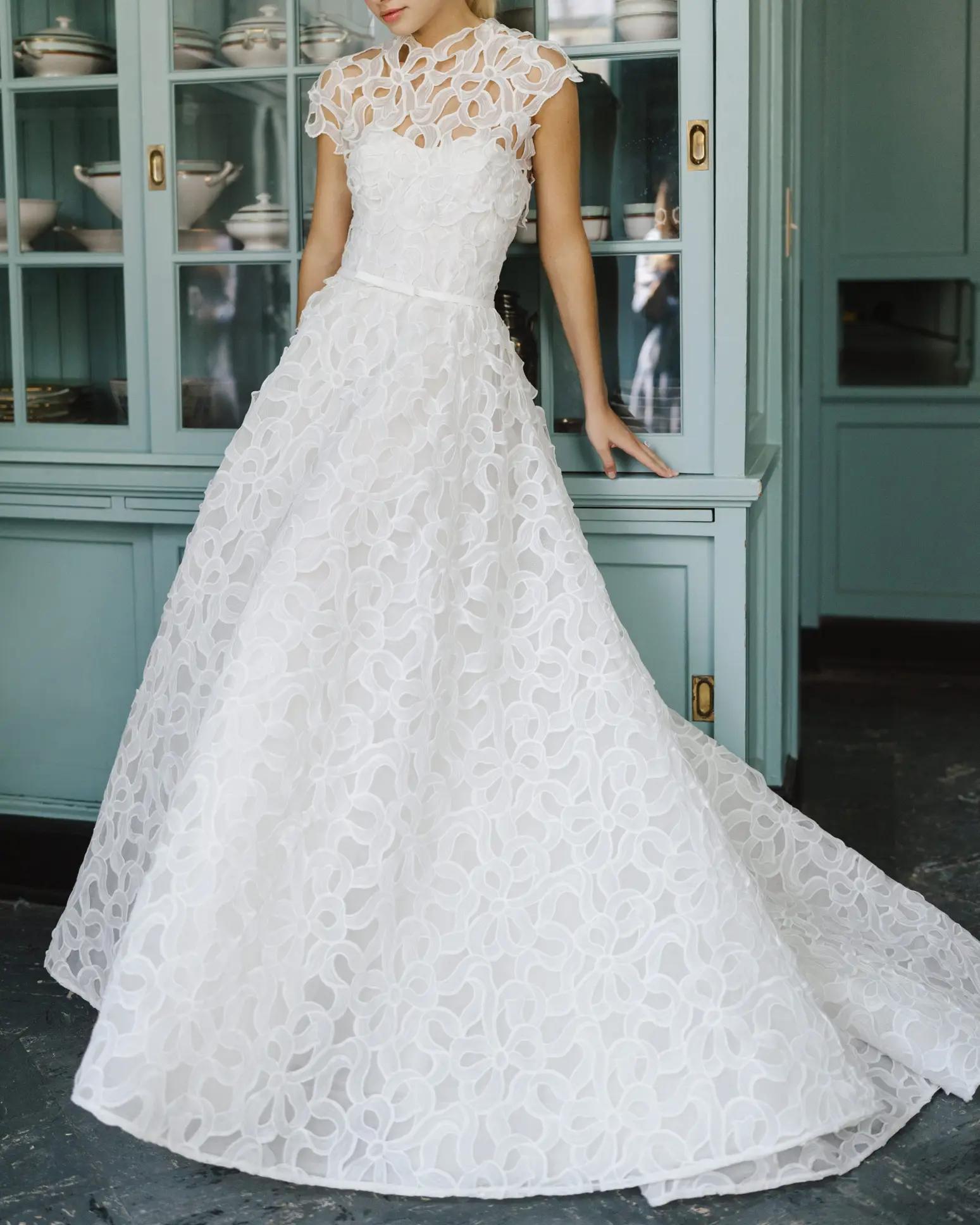 Irby ballgown wedding dress with laser cut bow detail and topper option by Anne Barge in Columbus Ohio