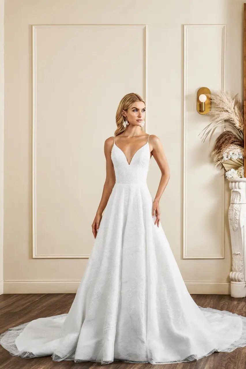 Sinclair wedding dress with modified sweetheart neckline and spaghetti straps with beaded lace all over detail and ballgown skirt in Columbus, Ohio