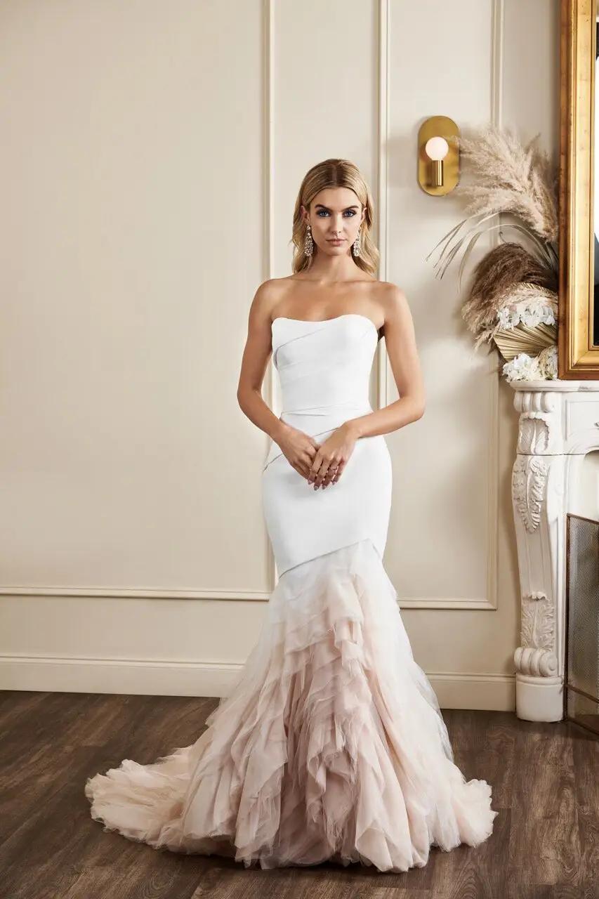 Sutton by Kelly Faetanini wedding dress with pleated sweetheart fitted body con silhouette and blush ombre tulle mermaid skirt in Columbus, Ohio