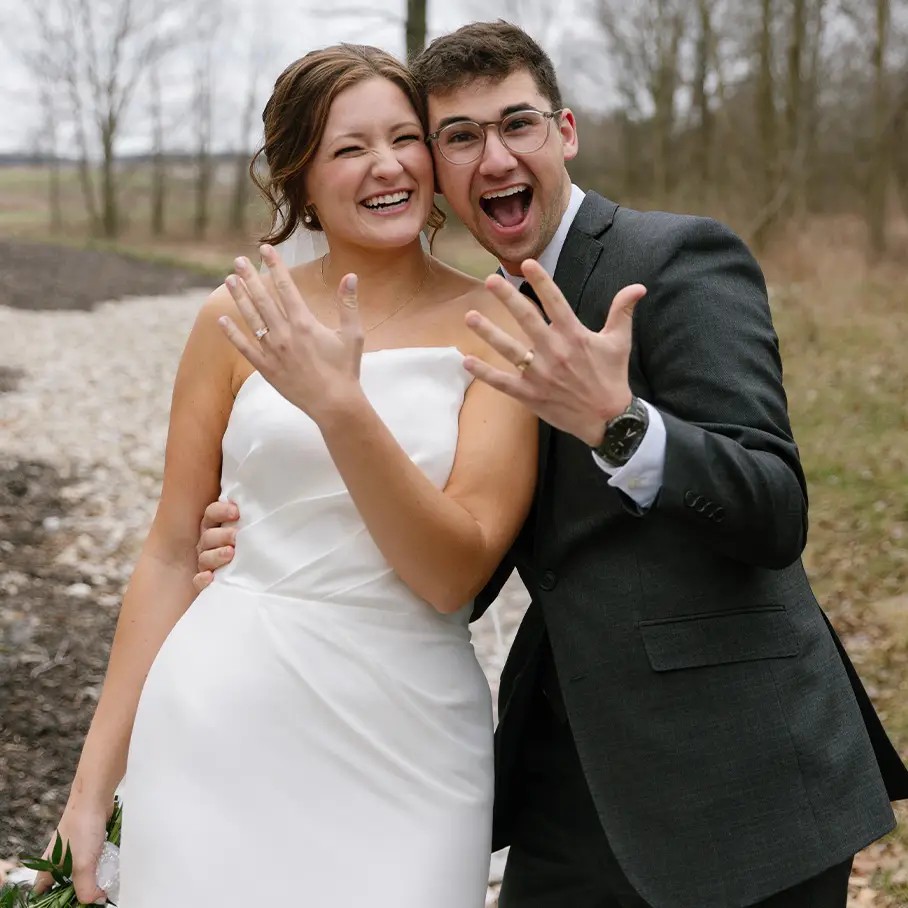 Сouple wearing a white gown and a white suit